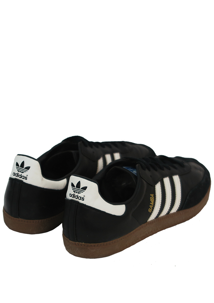 black adidas trainers with white stripes