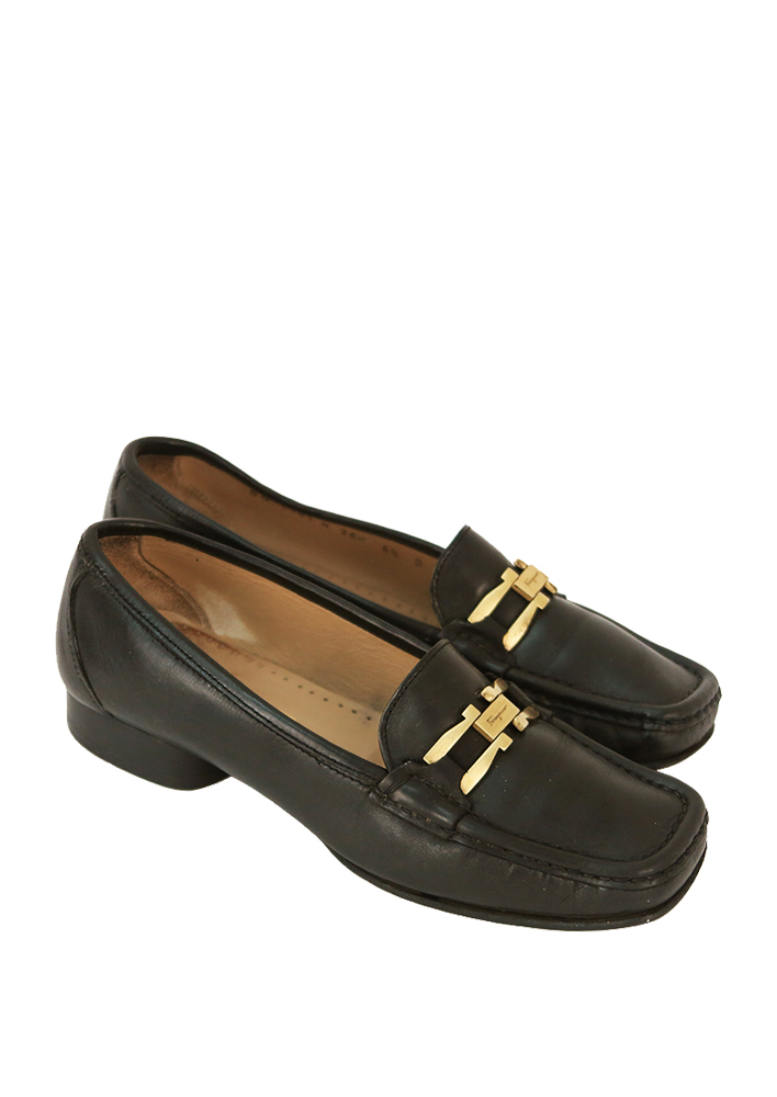 black leather loafers with gold buckle